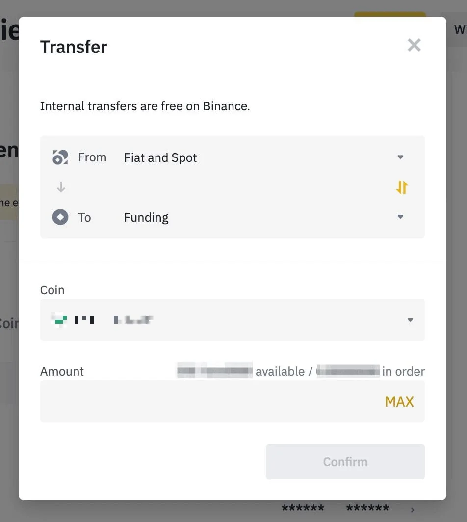 Example image from the Binance help article: the website's Transfer window with the line "Internal transfers are free on Binance", From set to "Fiat and Spot", To set to "Funding", a two-arrow button between them, the coin field blurred, an Amount field and a Confirm button